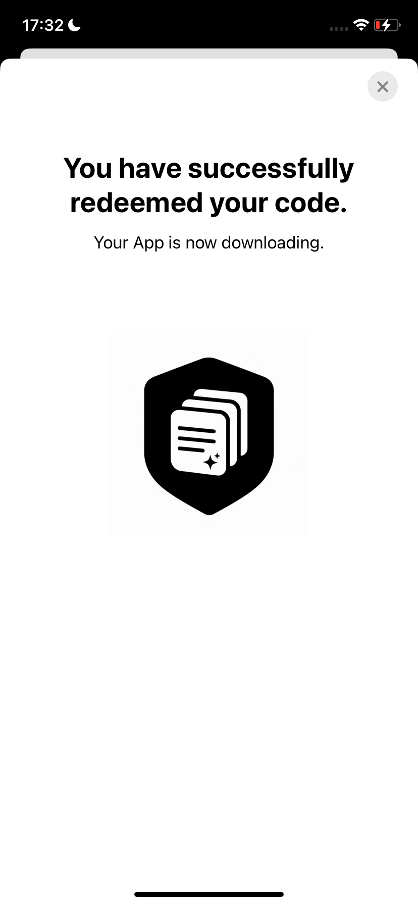 App Store confirmation saying the code was successfully redeemed and the app is downloading